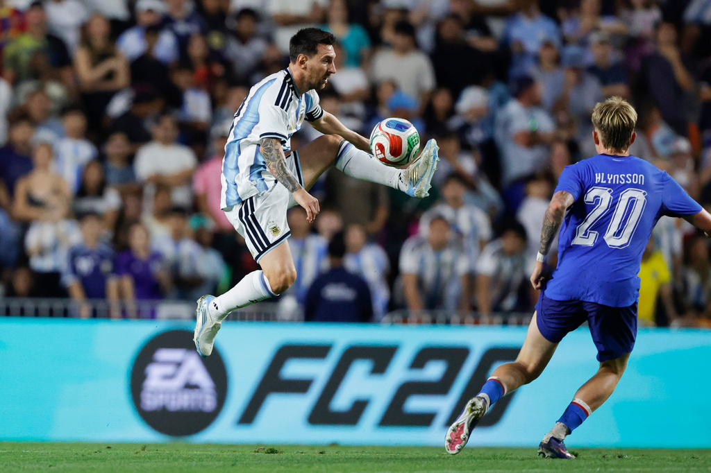 Argentina forward Lionel Messi (10) gets control of the ball as Iceland midfielder Kristian Hlynsson (20) defends during the second half of an international friendly match soccer match Tuesday, June 9, 2026, in Auburn, Ala. (AP Photo/Butch Dill)