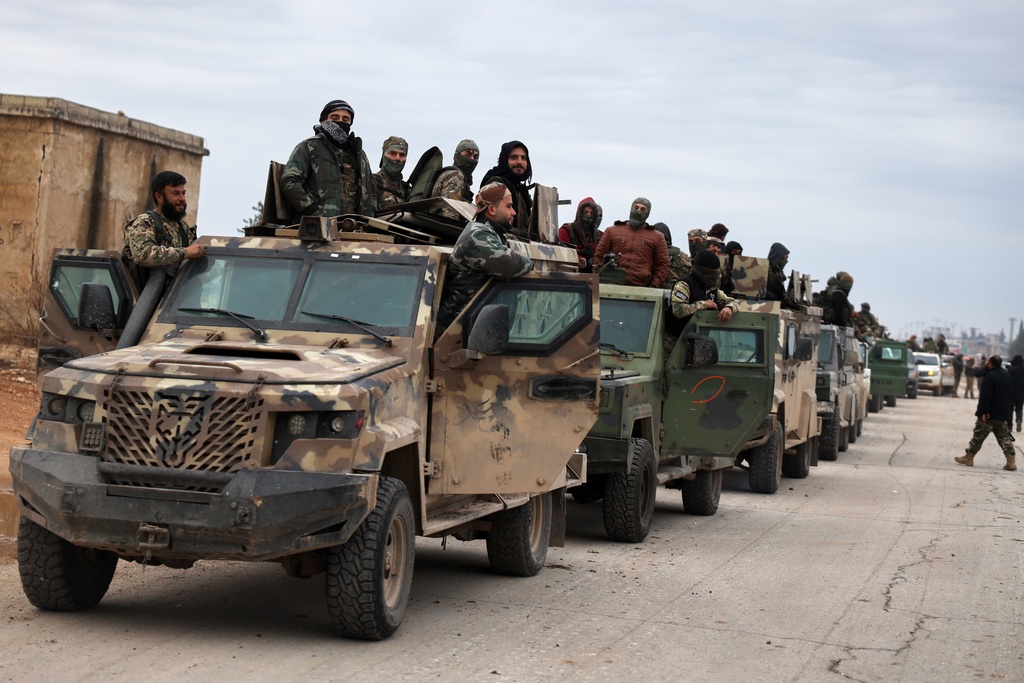 Syrian government forces enter the town of Deir Hafer, Saturday, Jan. 17, 2026, following the withdrawal of the U.S.-backed Syrian Democratic Forces. (AP Photo/Omar Albam)