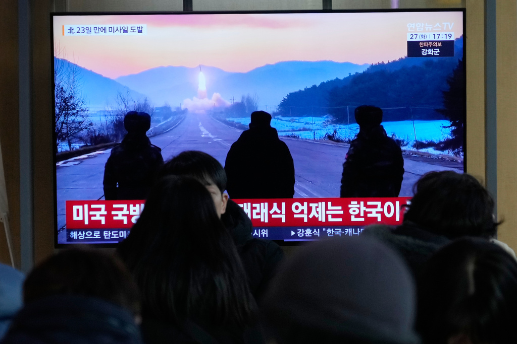 A TV screen shows a file image of North Korea's missile launch during a news program at Seoul Railway Station in Seoul, South Korea, Tuesday, Jan. 27, 2026. (AP Photo/Ahn Young-joon)