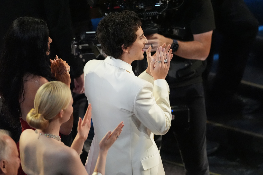 Timothee Chalamet in the audience clapping for Michael B. Jordan during the Oscars on Sunday, March 15, 2026, at the Dolby Theatre in Los Angeles. (AP Photo/Chris Pizzello)