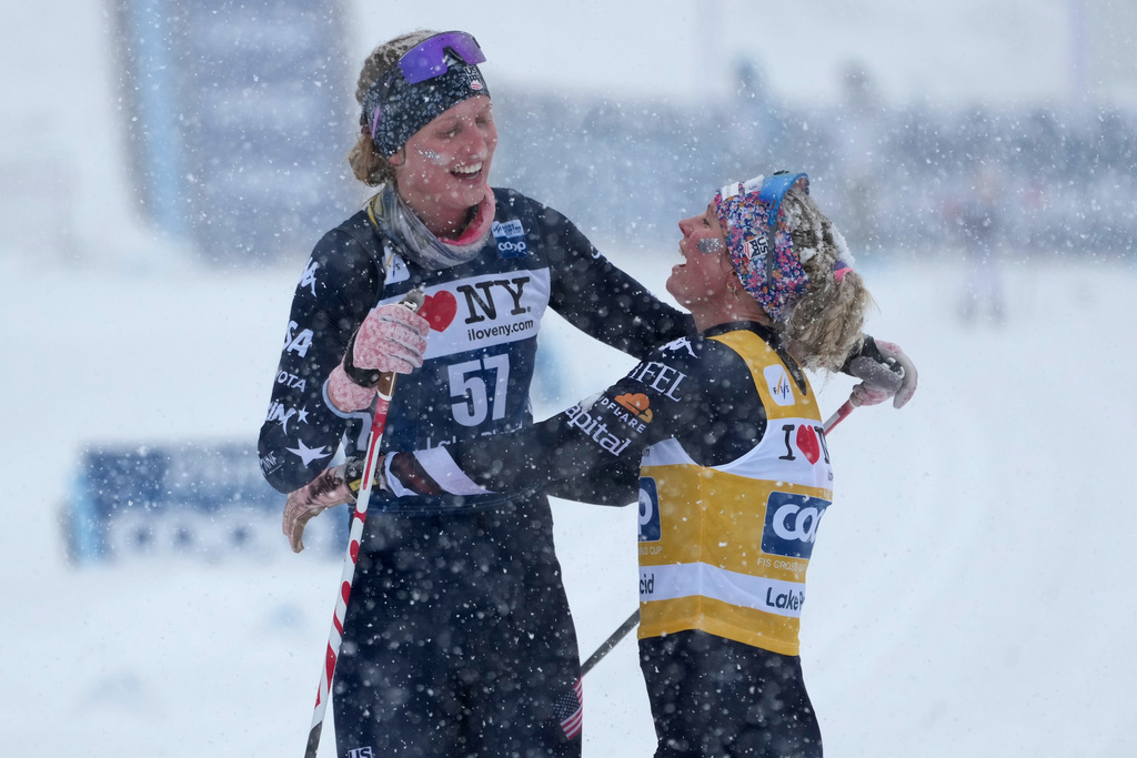 United States' Hailey Swirbul, left, and United States' Jessie Diggins embrace after the women's World Cup Finals Interval Start 10 km Classic cross country skiing race Friday, March 20, 2026, in Lake Placid, N.Y. (AP Photo/Robert F. Bukaty)