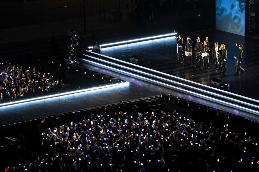 Kpop group BTS waves at the end of their 'BTS The Comeback Live Arirang' concert in central Seoul, South Korea, March 21, 2026. (Kim Hong-Ji/Pool Photo via AP)