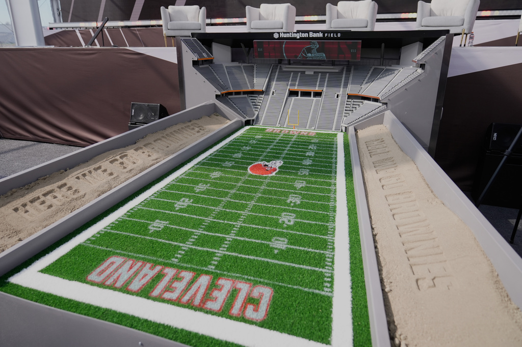 A model of the new Cleveland Browns stadium, minus the dome, is displayed before groundbreaking ceremonies in Brook Park, Ohio, Thursday, April 30, 2026. (AP Photo/Sue Ogrocki)