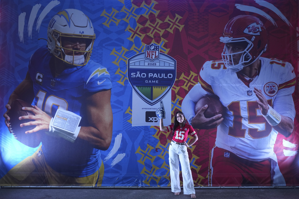 A fan poses before an NFL football game between the Kansas City Chiefs and the Los Angeles Chargers, Friday, Sept. 5, 2025, in Sao Paulo. (AP Photo/Andre Penner)