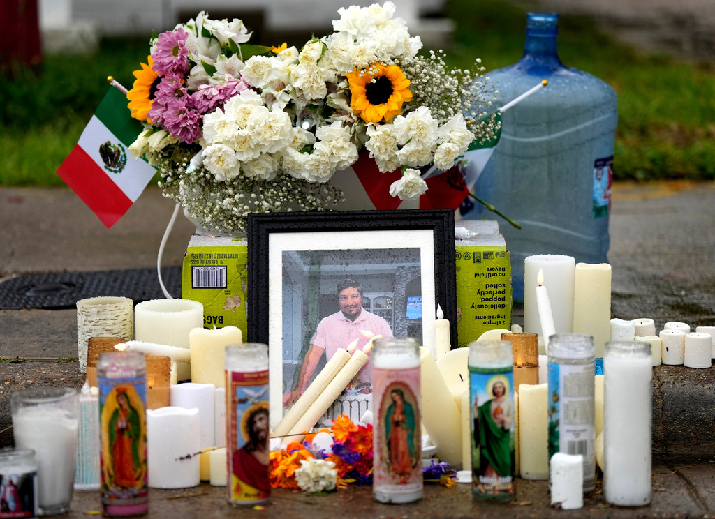 FILE - A memorial grows at the site where Lorenzo Salgado Araujo was fatally shot by ICE agents, last week, on Monday, July 13, 2026, in Houston. (AP Photo/Karen Warren,File)