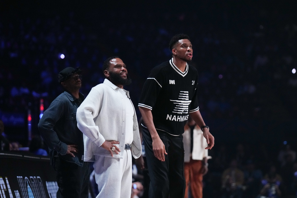 Coaches Giannis Antetokounmpo, right, and Anthony Anderson watch action during an NBA basketball's All-Star Celebrity Game Friday, Feb. 13, 2026, in Inglewood, Calif. (AP Photo/Jae C. Hong)