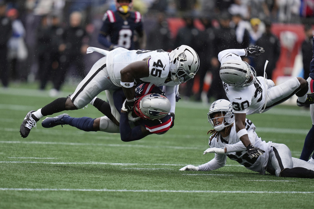 Las Vegas Raiders linebacker Devin White (45) tackles New England Patriots wide receiver Kayshon Boutte (9) during the first half of an NFL football game, Sunday, Sept. 7, 2025, in Foxborough, Mass. (AP Photo/Charles Krupa)