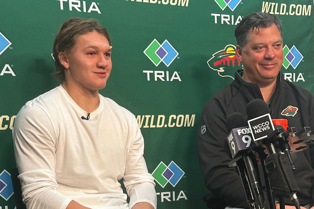 Minnesota Wild left wing Kirill Kaprizov and general manager Bill Guerin discuss Kaprizov's contract extension on Tuesday, Sept. 30, 2025, in St. Paul, Minn. (AP Photo/Dave Campbell)