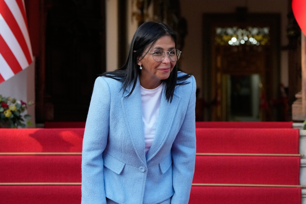 Venezuela's acting President Delcy Rodriguez smiles after bidding farewell to U.S. Energy Secretary Chris Wright following their meeting at Miraflores Palace in Caracas, Venezuela, Wednesday, Feb. 11, 2026. (AP Photo/Ariana Cubillos)