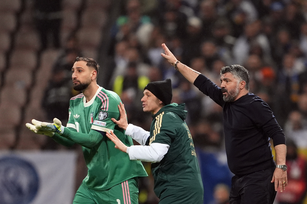 Italy's, from left, Gianluigi Donnarumma, Nicolò Barella and coach Gennaro Gattuso react during the World Cup qualifying playoff final soccer match between Bosnia and Italy in Zenica, Bosnia, Tuesday, March 31, 2026. (Fabio Ferrari/LaPresse via AP)