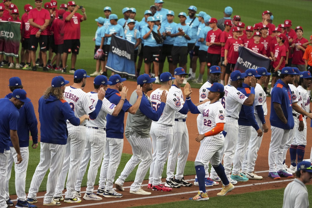 New York Mets outfielder Juan Soto is introduced before the Little League Classic baseball game against the Seattle Mariners at Bowman Field in Williamsport, Pa., Sunday, Aug. 17, 2025. (AP Photo/Gene J. Puskar)