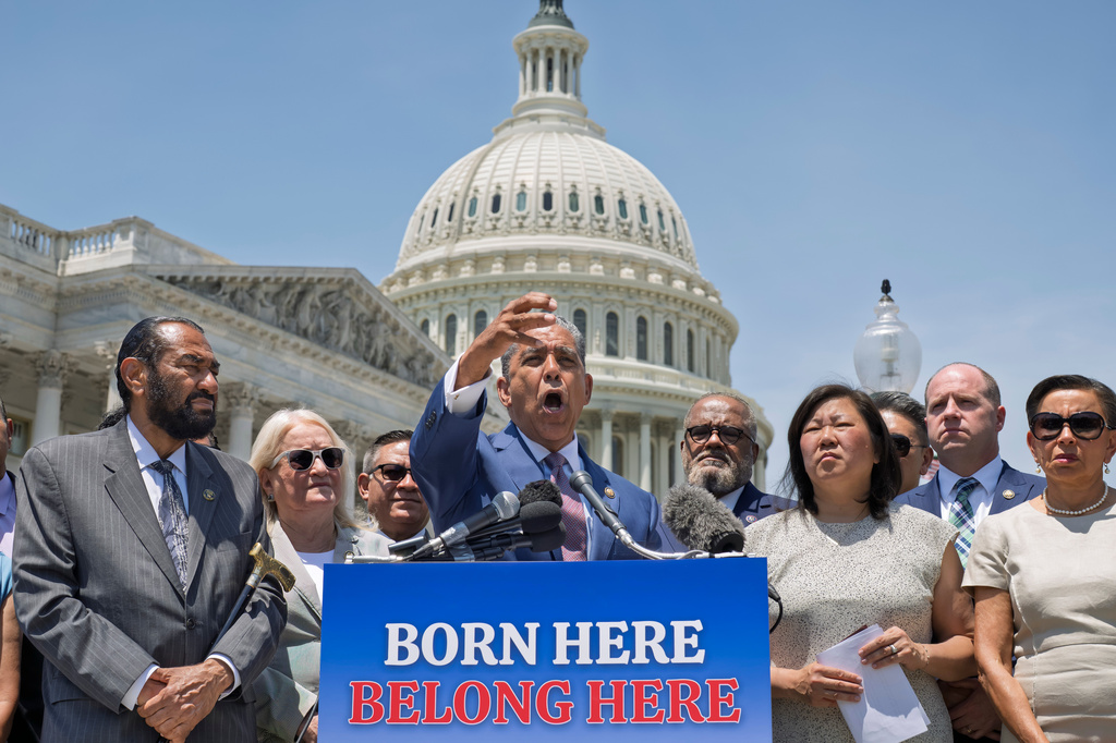 Congressional Hispanic Caucus Chairman Adriano Espaillat, D-N.Y., center, and other Democratic House members react to the Supreme Court's decision to uphold birthright citizenship at the Capitol in Washington, Tuesday, June 30, 2026. (AP Photo/J. Scott Applewhite)
