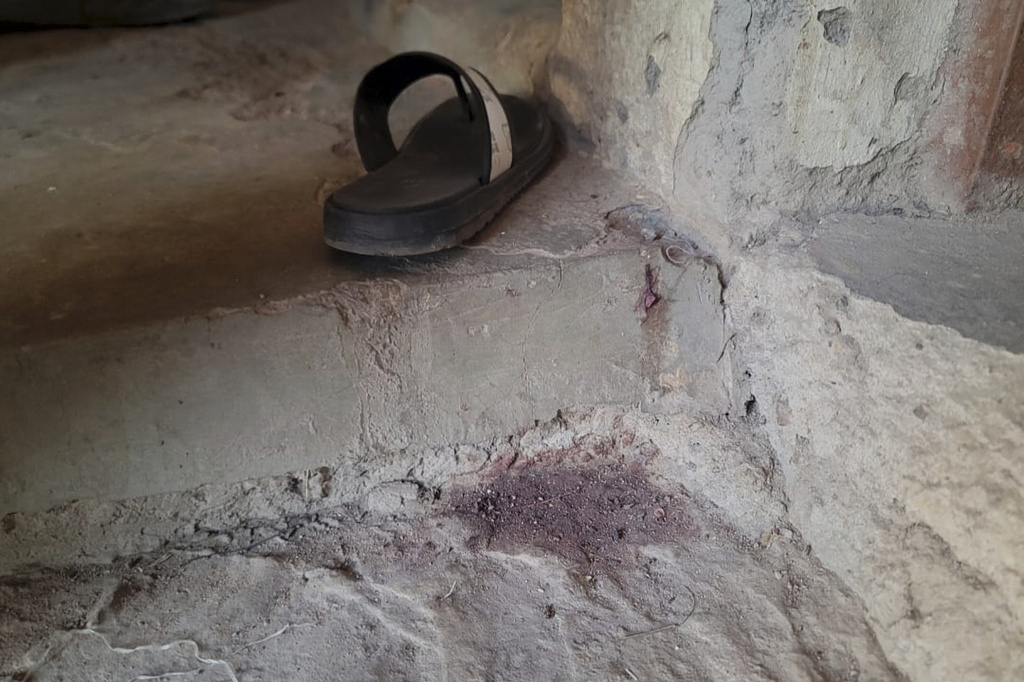 A stain of blood is seen on the ground of the Government Girls Comprehensive Secondary School, where gunmen on Monday attacked the school dormitory, abducted schoolgirls, and killed Hassan Yakubu Makuku, vice principal of the school, in Kebbi, Nigeria, Tuesday, Nov. 18, 2025. (AP Photo/Tunde Omolehin)