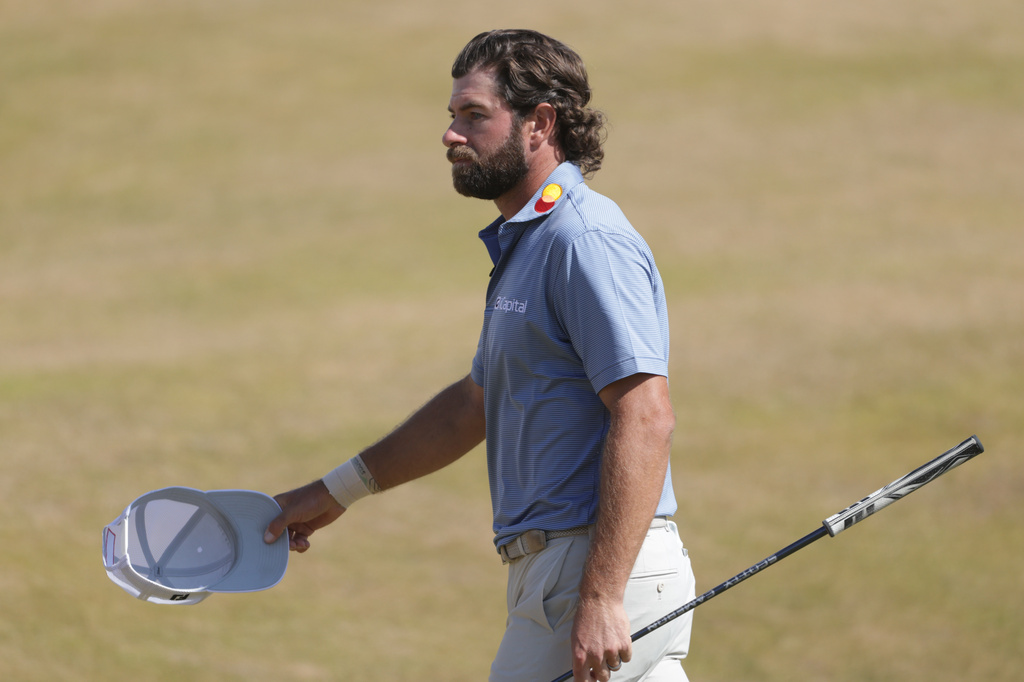 Cameron Young of the United States acknowledges the crowd as he walks off the 18th green after completing his final round during the final day of the British Open Golf championships at Royal Birkdale golf club, in Southport, England, Sunday, July 19, 2026. (AP Photo/Peter Morrison)
