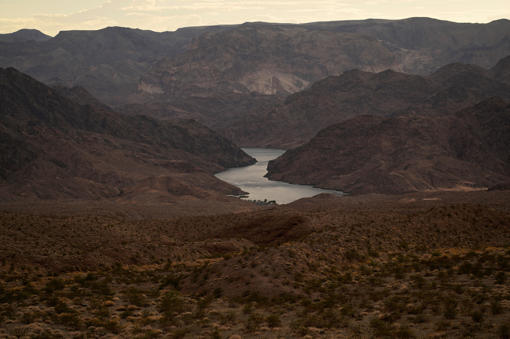 FILE - Water flows down the Colorado River downriver from Hoover Dam in northwest Arizona, on Aug. 14, 2022, near the Lake Mead National Recreation Area. (AP Photo/John Locher, File)