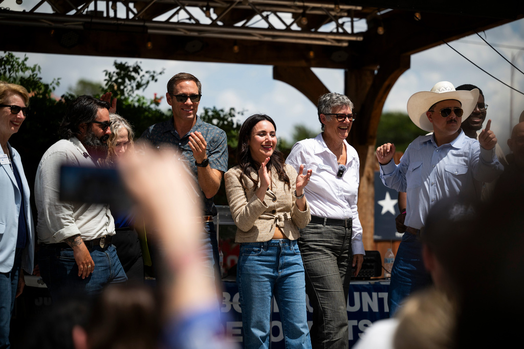 Democratic candidate for Texas governor Gina Hinojosa, center, stands on stage with other Democratic candidates after speaking at a rally, Saturday, July 18, 2026, in Lubbock, Texas. (AP Photo/Justin Rex)