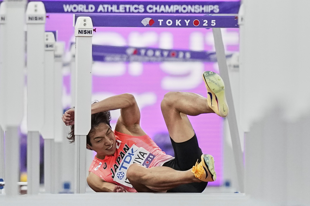 Japan's Shunsuke Izumiya crashes in a men's 110 meters hurdles semifinal at the World Athletics Championships in Tokyo, Tuesday, Sept. 16, 2025. (AP Photo/Petr David Josek)