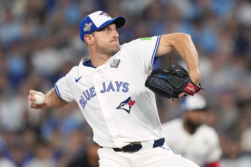 FILE - Toronto Blue Jays pitcher Max Scherzer (31) delivers a pitch against the Los Angeles Dodgers during first inning in Game 7 of baseball's World Series in Toronto, Saturday, Nov. 1, 2025. (Nathan Denette/The Canadian Press via AP, File)
