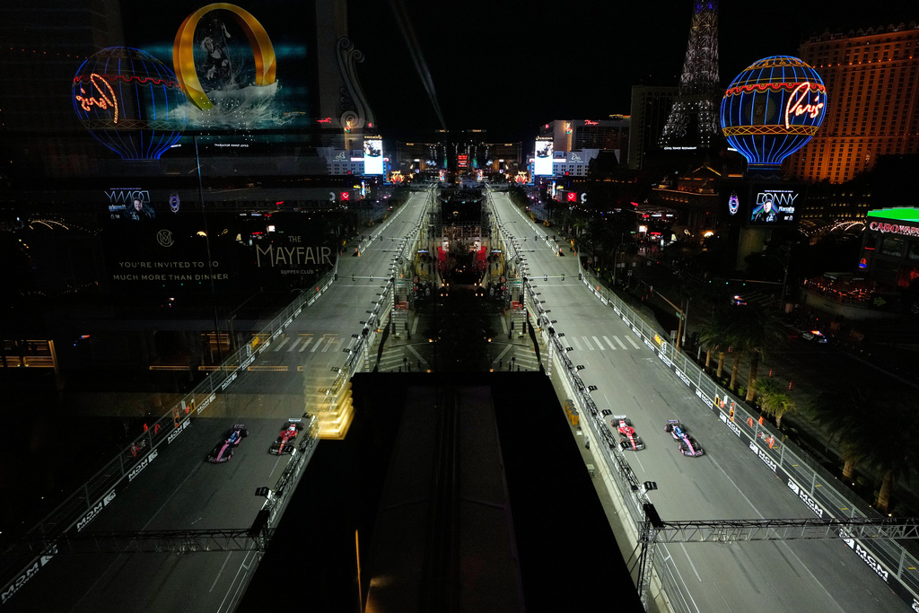 Ferrari driver Charles Leclerc of Monaco and Alpine driver Pierre Gasly of France drive during a practice session at the F1 Las Vegas Grand Prix auto race , Thursday, Nov. 20, 2025 in Las Vegas. (AP Photo/John Locher)