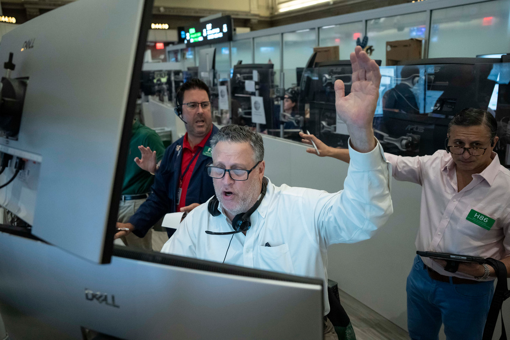 Options trader Marty Handler works on the floor of the New York Stock Exchange, Thursday, Aug. 27, 2026, in New York. (AP Photo/Yuki Iwamura)