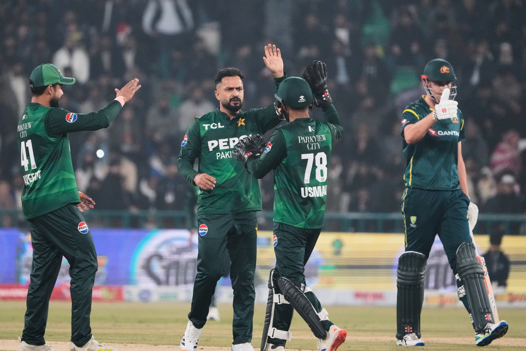 Pakistan's Mohammad Nawaz, center, celebrates with teammates after the dismissal of Australia's Matt Renshaw during the second T20 cricket match between Pakistan and Australia, in Lahore, Pakistan, Saturday, Jan. 31, 2026. (AP Photo/K.M. Chaudary)
