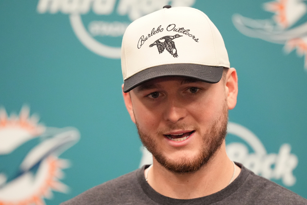 Miami Dolphins quarterback Quinn Ewers speaks during a news conference following a loss to the Cincinnati Bengals in an NFL football game, Sunday, Dec. 21, 2025, in Miami Gardens, Fla. (AP Photo/Rebecca Blackwell)