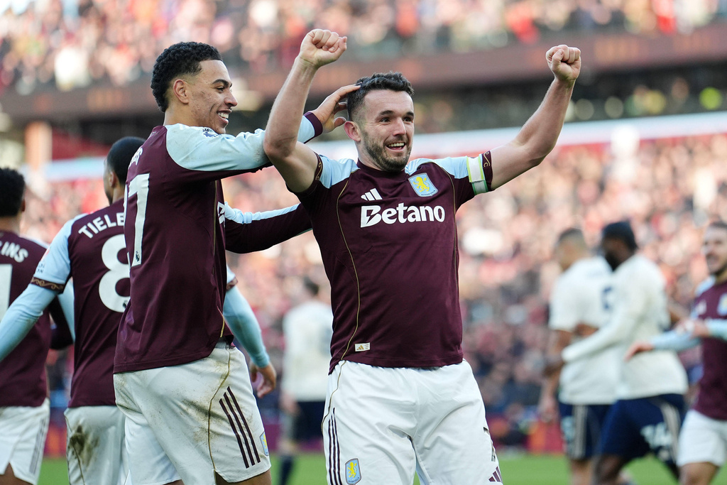 Aston Villa's John McGinn celebrates scoring their side's second goal during their English Premier League soccer match against Nottingham Forest in Birmingham, England, Saturday, Jan. 3, 2026. (Cody Froggatt/PA via AP)