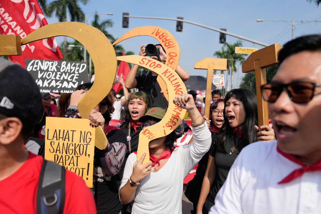 Protesters shout slogans during an anti-corruption protest in Manila, Philippines on Sunday Nov. 30, 2025. (AP Photo/Aaron Favila)
