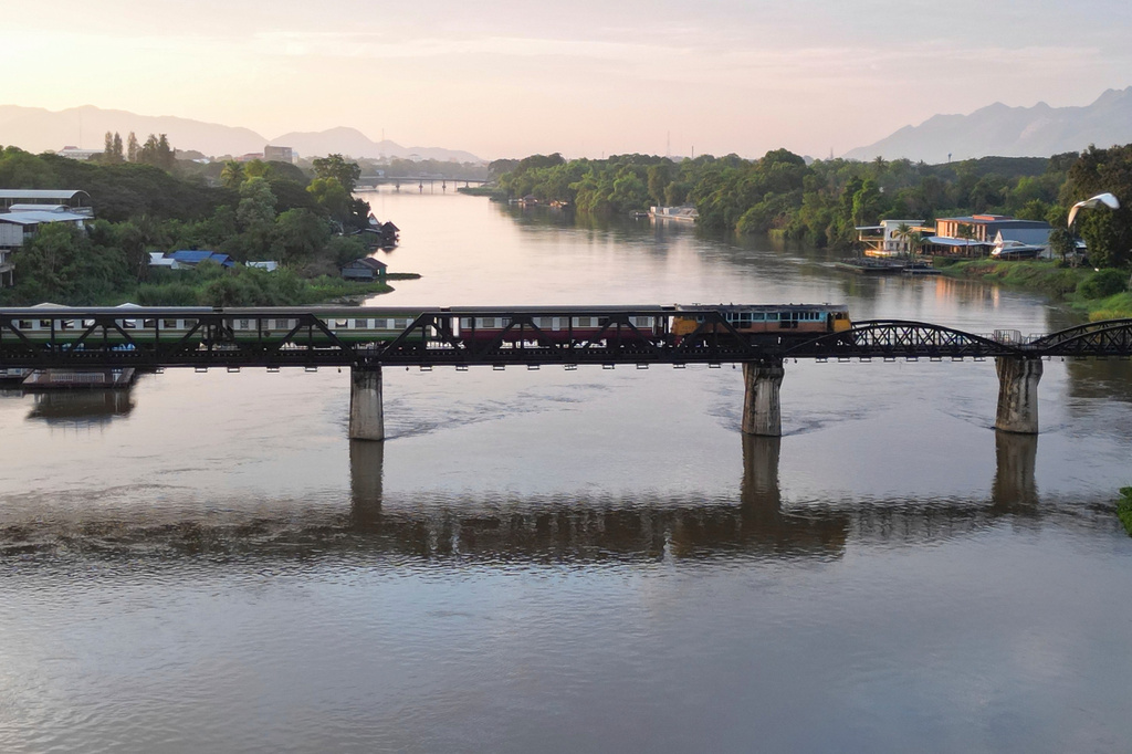 A train crosses the River Kwai Bridge, one of the most inconic sections of the infamous World War II "Death Railway," in Kanchanaburi, Thailand, Sunday, May 31, 2026. (AP Photo/Anton L. Delgado)