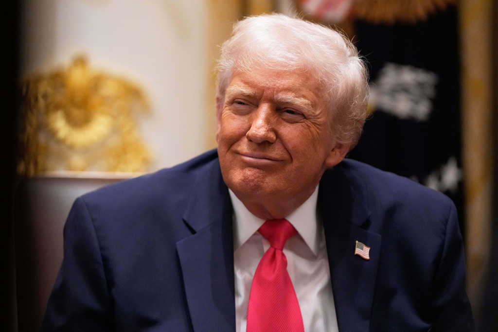 President Donald Trump listens during a Cabinet meeting at the White House, Tuesday, Dec. 2, 2025, in Washington. (AP Photo/Julia Demaree Nikhinson)