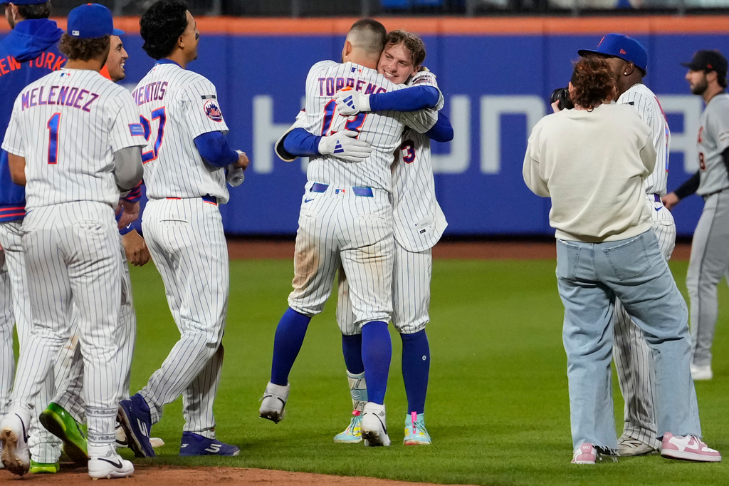 New York Mets' Carson Benge (3) celebrates with New York Mets' Luis Torrens after hitting a walk-off RBI single during the tenth inning of a baseball game against the Detroit Tigers, Wednesday, May 13, 2026, in New York. (AP Photo/Yuki Iwamura)