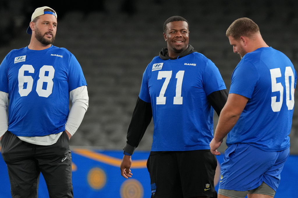 Los Angeles Rams offensive lineman David Quessenberry, left, offensive lineman Warren McClendon Jr., centre, and offensive lineman Beaux Limmer, right, works out during a practice session for an NFL football game against the San Francisco 49ers, in Melbourne, Australia, Thursday, Sept. 10, 2026. (AP Photo/Asanka Brendon Ratnayake)