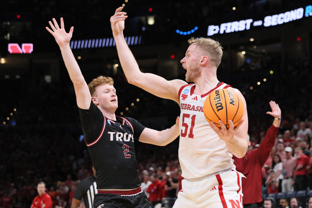Nebraska forward Rienk Mast (51) yells to teammates as Troy guard Cobi Campbell (2) defends during the first half in the first round of the NCAA college basketball tournament, Thursday, March 19, 2026, in Oklahoma City. (AP Photo/Nate Billings)