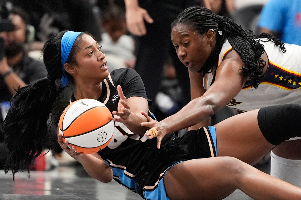 Atlanta Dream forward Angel Reese (5) and Indiana Fever center Aliyah Boston (7) fight for the ball in the second half of an WNBA basketball game Sunday, Aug. 16, 2026, in Atlanta. (AP Photo/Brynn Anderson)