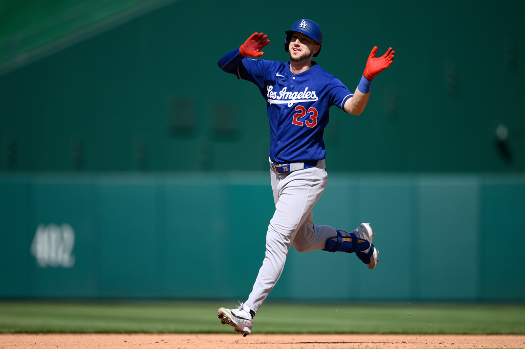 Los Angeles Dodgers' Kyle Tucker celebrates his home run as he rounds the bases during the seventh inning of a baseball game against the Washington Nationals, Friday, April 3, 2026, in Washington. (AP Photo/Nick Wass)