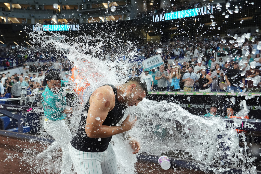 Miami Marlins' Agustín Ramírez is doused after hitting a walk-off two run home run in the ninth inning to defeat the Los Angeles Dodgers in a baseball game, Sunday, Sept. 13, 2026, in Miami. (AP Photo/Lynne Sladky)