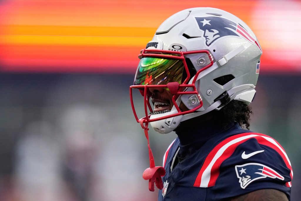 New England Patriots wide receiver Stefon Diggs warms up before an NFL football game against the Miami Dolphins in Foxborough, Mass., Sunday, Jan. 4, 2026. (AP Photo/Charles Krupa)