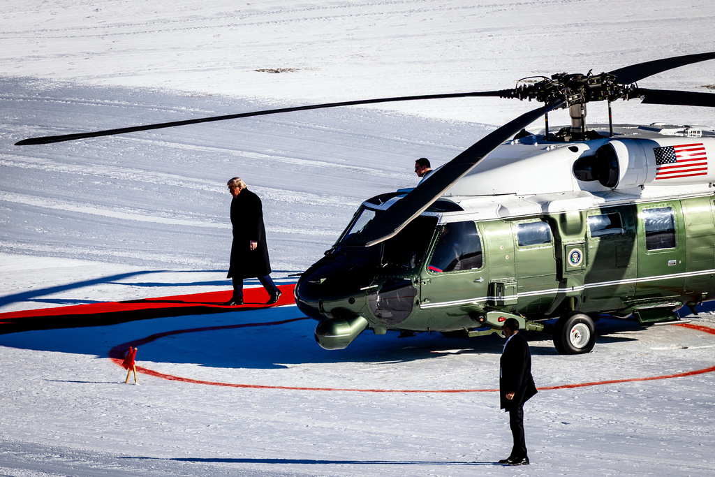 US President Donald Trump walks out of the Marine One helicopter as he arrives for the 56th annual meeting of the World Economic Forum, WEF, in Davos, Switzerland, Wednesday, Jan. 21, 2026. (Michael Buholzer/Keystone via AP)