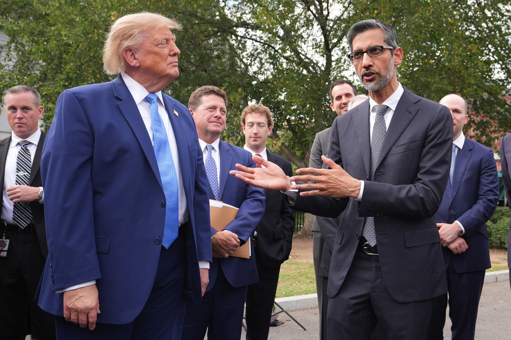 President Donald Trump listens as Google CEO Sundar Pichai speaks to reporters at the White House in Washington, Tuesday Sept. 29, 2026, after meeting with top executives of AI firms. (AP Photo/Alex Brandon)