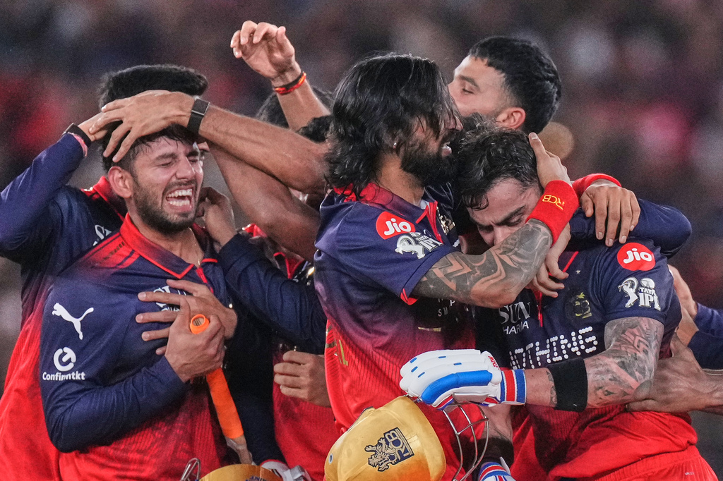 Royal Challengers Bengaluru players celebrate after their win in the Indian Premier League final cricket match against Gujarat Titans in Ahmedabad, India, Sunday, May 31, 2026. (AP Photo/Ajit Solanki)