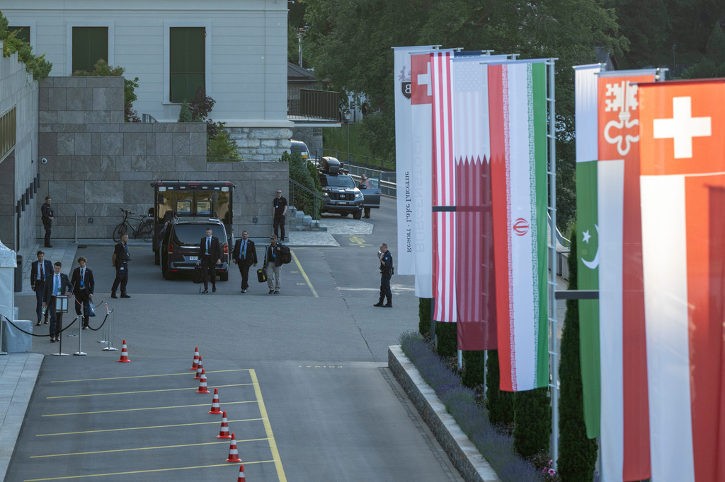 Flags of the U.S., Qatar, Iran, Pakistan, Nidwalden and Switzerland, from left, are seen at the Buergenstock resort in Obbuergen, near Lucerne, Switzerland, Sunday, June 21, 2026. (Urs Flueeler/Keystone Pool via AP)
