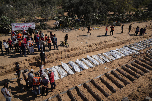 Bodies of unidentified Palestinians returned from Israel are buried in a mass grave in Deir al-Balah, Gaza Strip, Monday, Oct. 27, 2025. (AP Photo/Jehad Alshrafi) Bodies of unidentified Palestinians returned from Israel are buried in a mass grave in Deir al-Balah, Gaza Strip, Monday, Oct. 27, 2025. (AP Photo/Jehad Alshrafi)