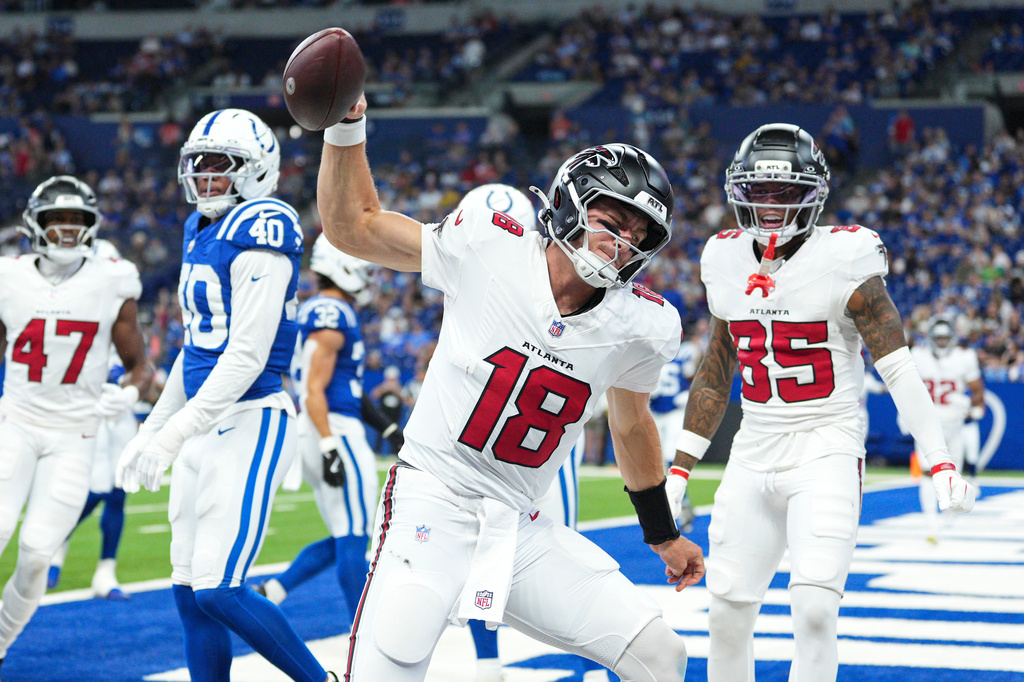 Atlanta Falcons quarterback Jack Strand (18) celebrates a touchdown against the Indianapolis Colts during the second half of an NFL football game in Indianapolis, Saturday, Aug. 22, 2026. (AP Photo/AJ Mast)