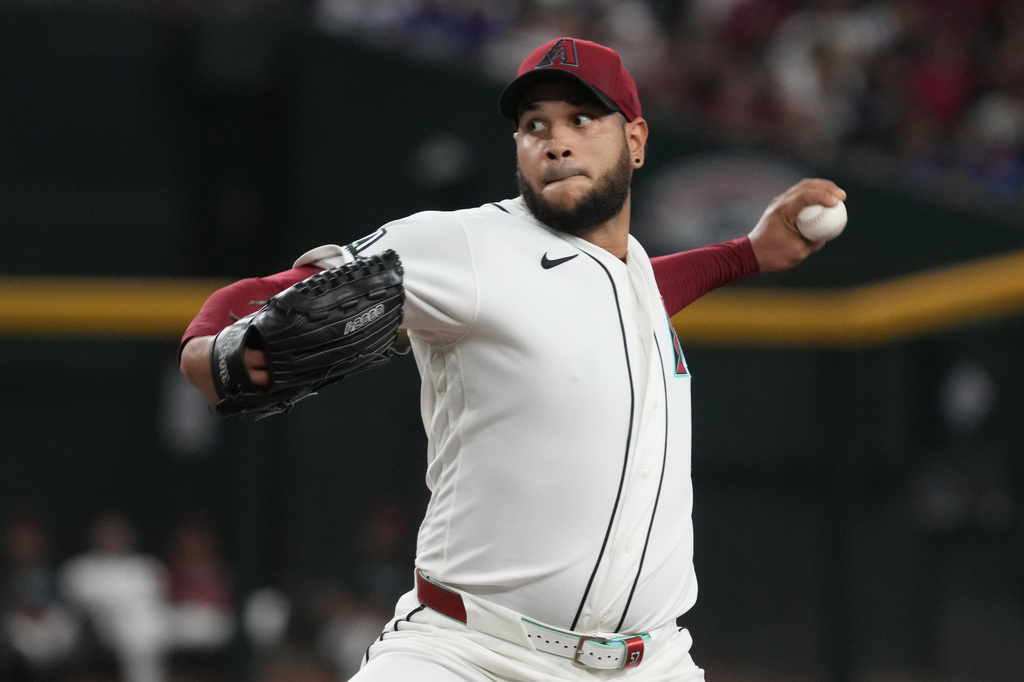 Arizona Diamondbacks pitcher Eduardo Rodriguez throws against the Los Angeles Dodgers in the first inning of a baseball game, Sunday, Aug 9, 2026, in Phoenix. (AP Photo/Rick Scuteri)