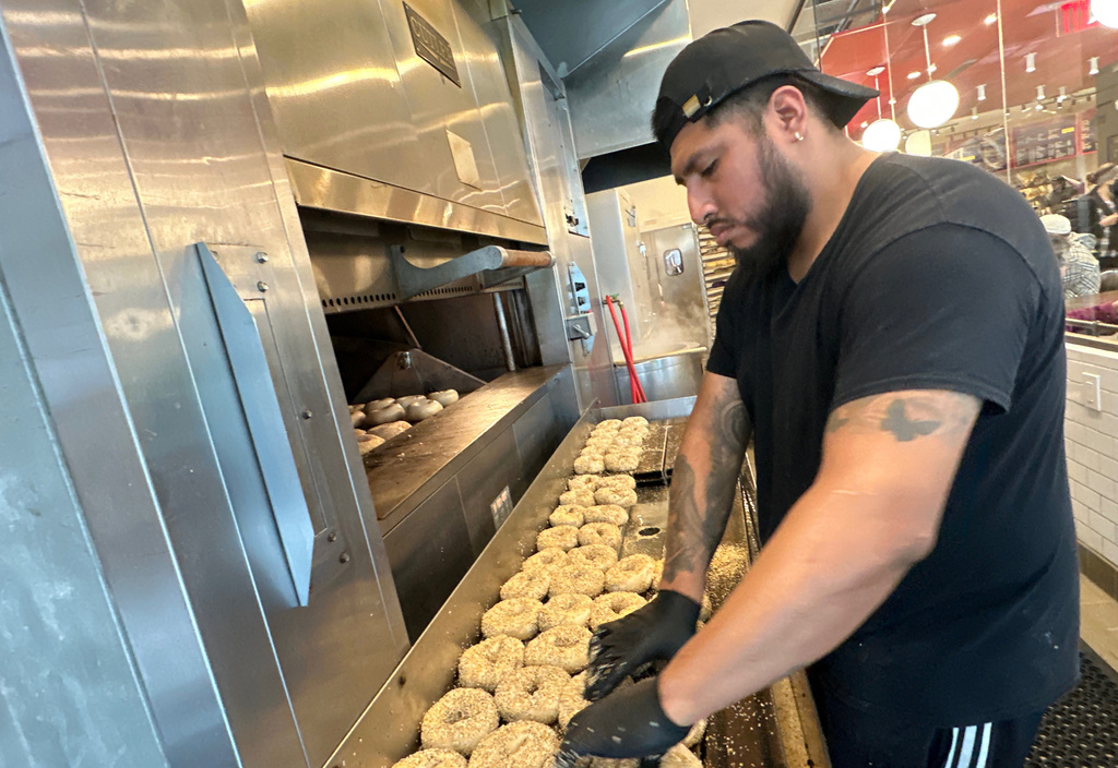 A worker at Utopia Bagel preps bagels made with bromated flour, May 13, 2026, in the Queens borough of New York. (AP Photo/David R. Martin)