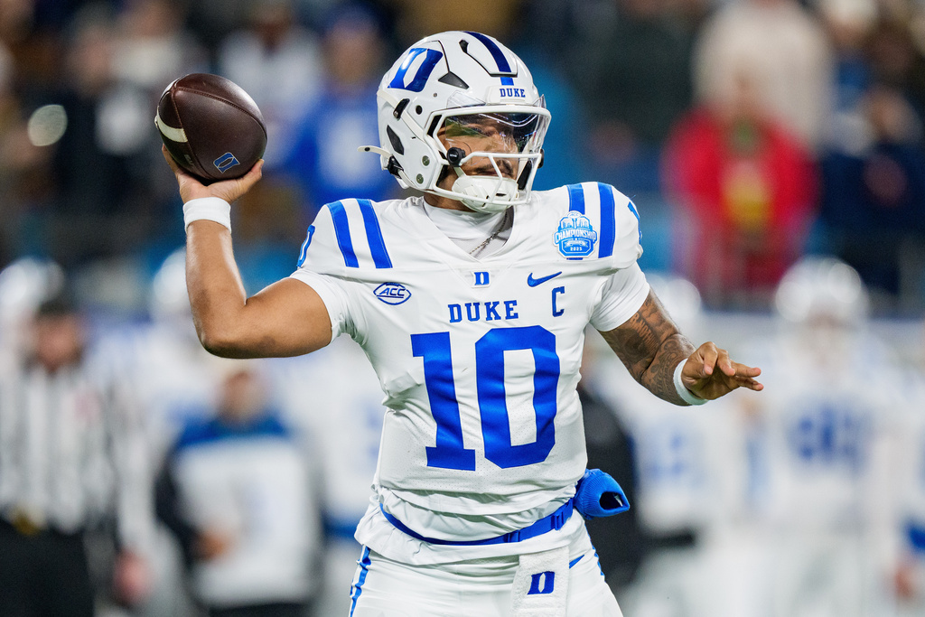 FILE - Duke quarterback Darian Mensah looks to pass the ball against Virginia in the first half of the Atlantic Coast Conference championship NCAA college football game in Charlotte, N.C., Dec. 6, 2025. (AP Photo/Jacob Kupferman)