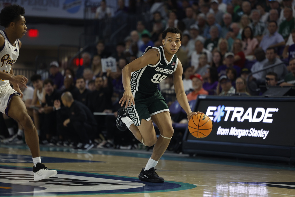 Michigan State guard Divine Ugochukwu dribbles the ball against East Carolina during the second half of an NCAA college basketball game, Tuesday, Nov. 25, 2025 in Ft. Myers, Fla. (AP Photo/Scott Audette)