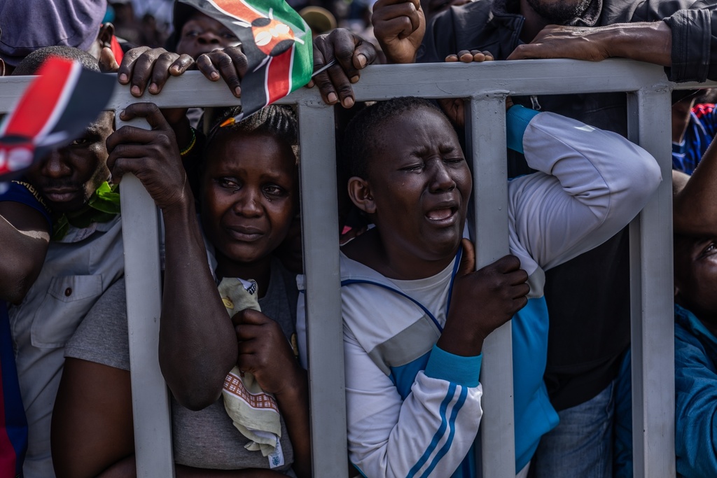 People react during the viewing of the body of former Kenya Prime Minister Raila Odinga at Jomo Kenyatta Stadium in Kisumu, Kenya, Saturday, Oct. 18, 2025. (AP Photo/Samson Otieno)