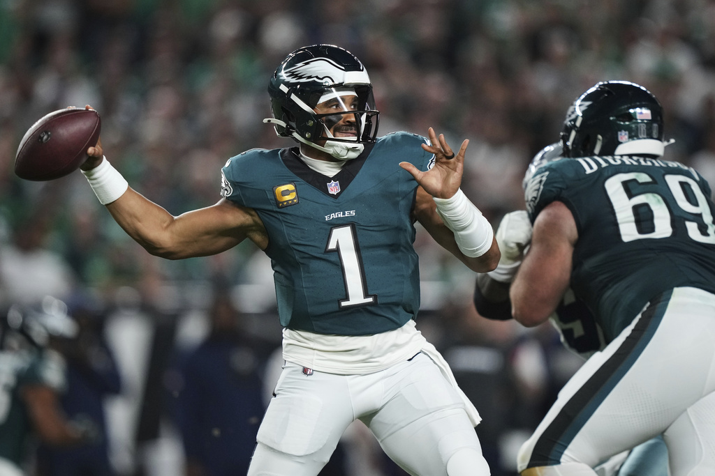 Philadelphia Eagles quarterback Jalen Hurts (1) throws a pass in the first half of an NFL football game against the Dallas Cowboys Thursday, Sept. 4, 2025, in Philadelphia. (AP Photo/Matt Slocum)