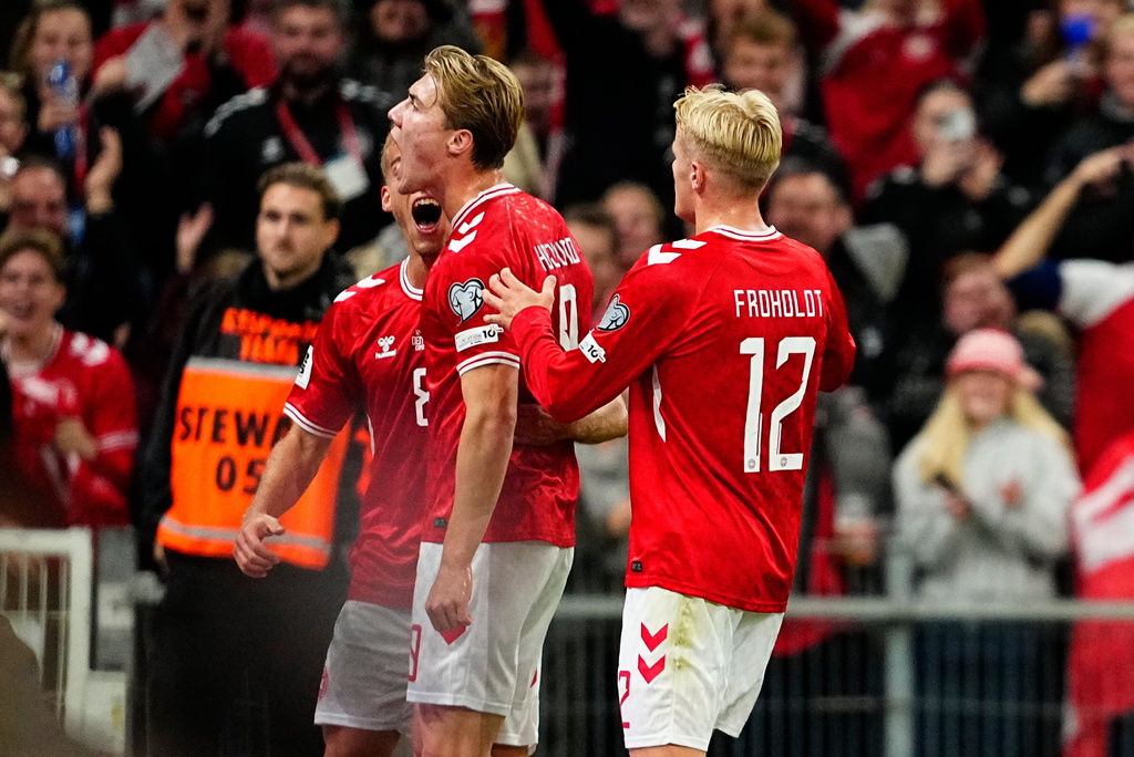 Denmark's Rasmus Hoejlund, centre, celebrates with teammates after scoring the opening goal during the World Cup group C qualification match between Denmark and Greece at Parken stadium in Copenhagen, Sunday, Oct. 12, 2025. (Mads Claus Rasmussen/Ritzau Scanpix via AP)